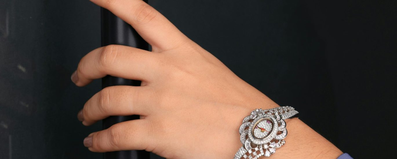 A woman's hand with a watch on her wrist