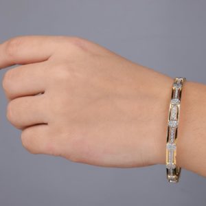 A woman's arm with a bracelet on it
